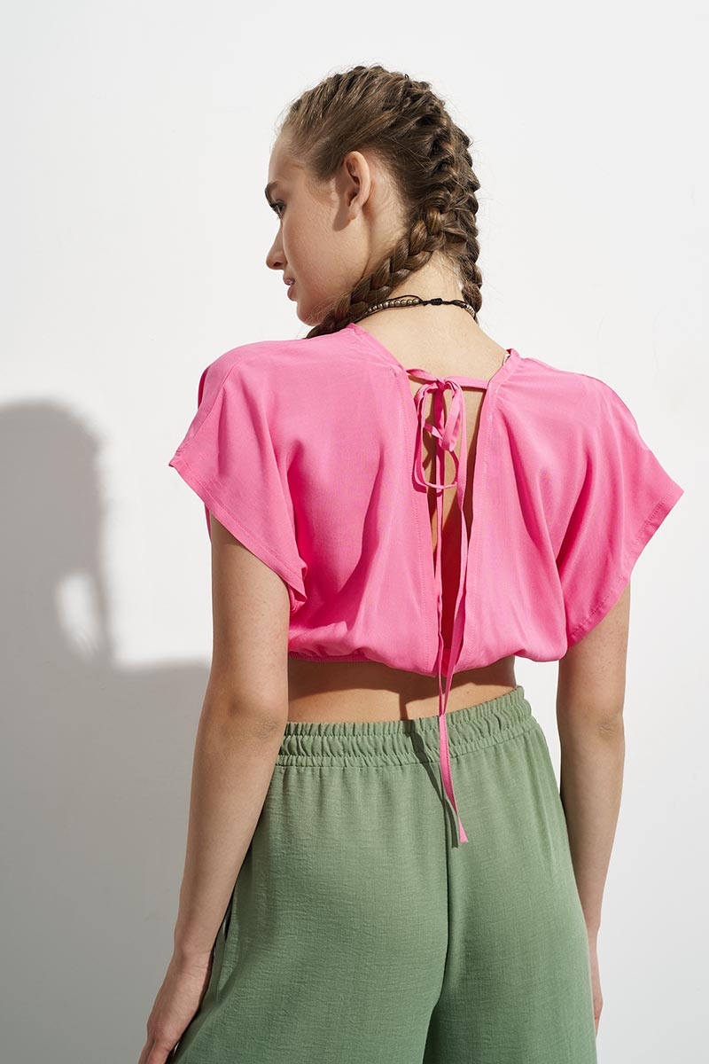 PINK TOP WITH A TIE ON THE BACK