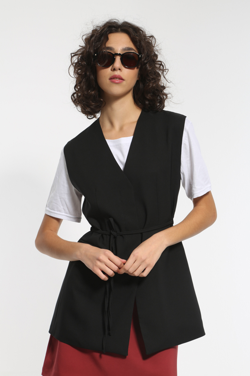 BLACK CROSS VEST WITH A TIE AT THE WAIST