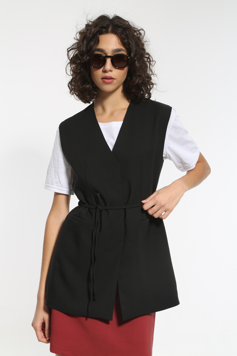 BLACK CROSS VEST WITH A TIE AT THE WAIST